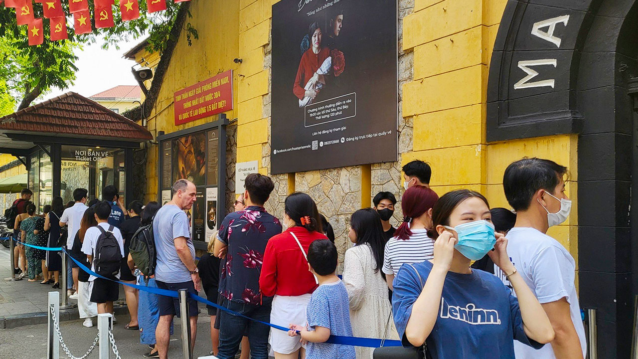Tourists visit Hoa Lo prison